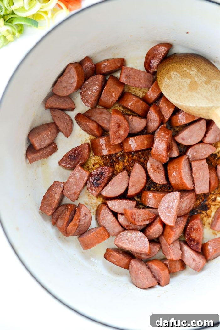 Browned kielbasa in a Dutch oven, then transferred to a bowl