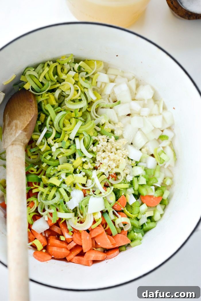 Add sautéed vegetables and garlic with salt to the pot
