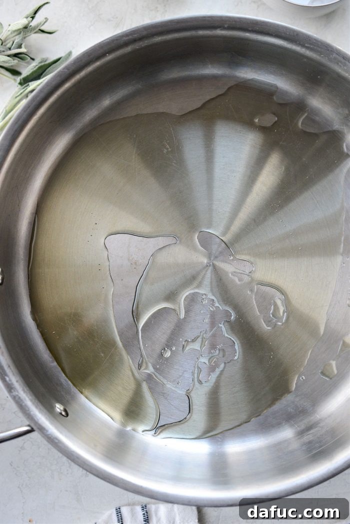 Heating avocado oil in a large skillet