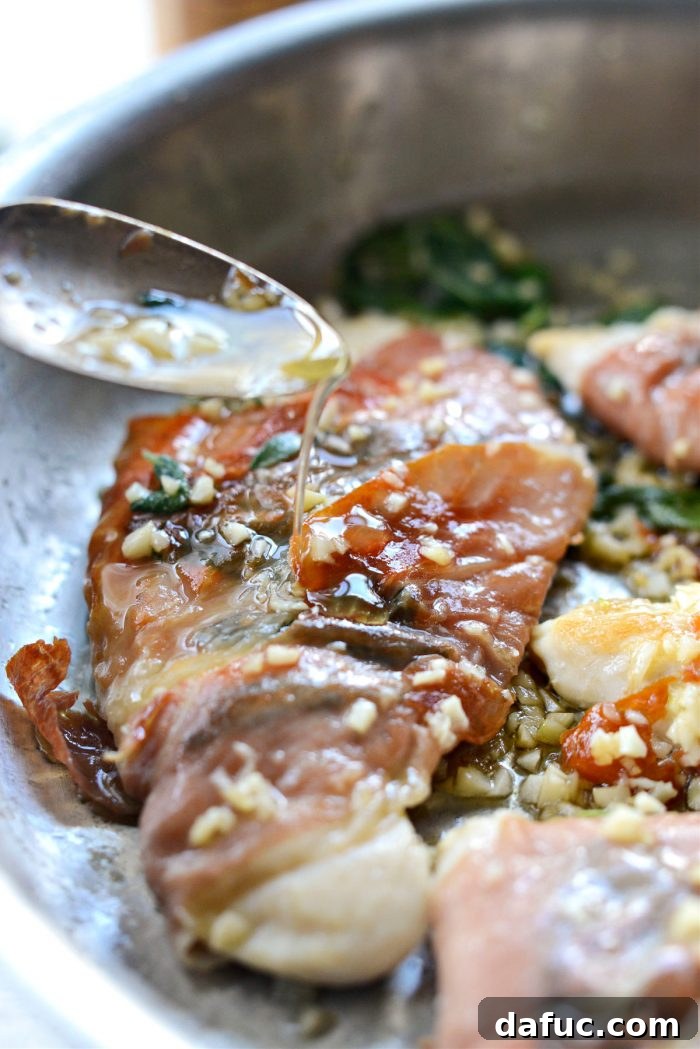 Basting garlic prosciutto sage chicken with garlic sage butter