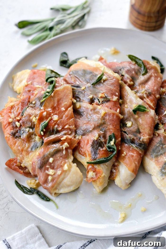 Close-up of crispy Garlic Prosciutto Sage Chicken with fresh herbs
