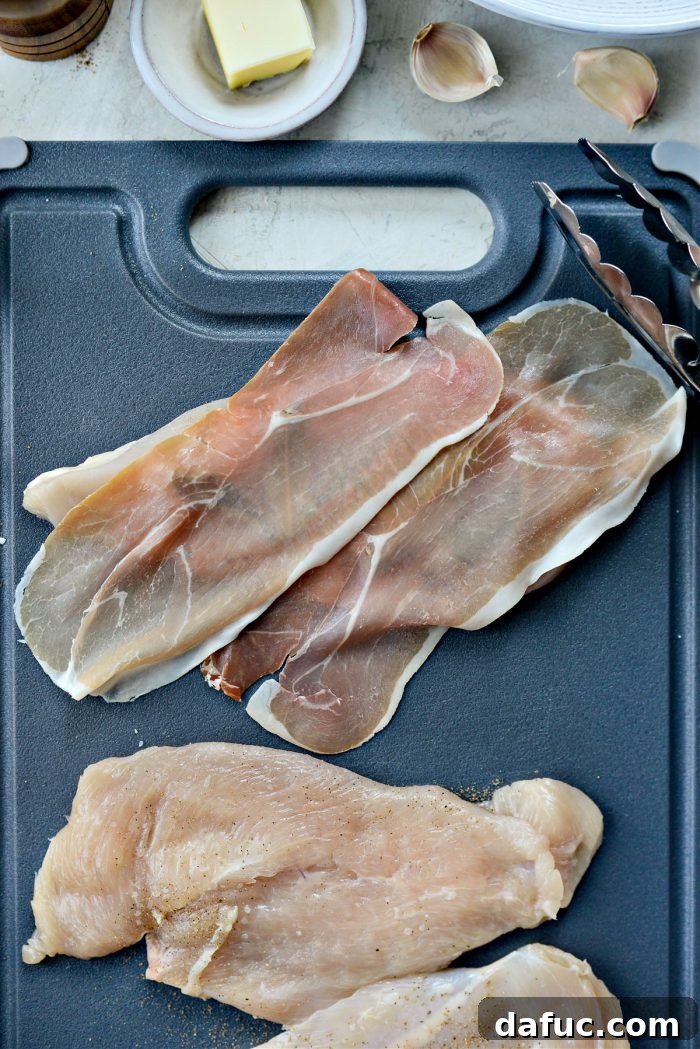 Wrapping chicken with sage and prosciutto slices