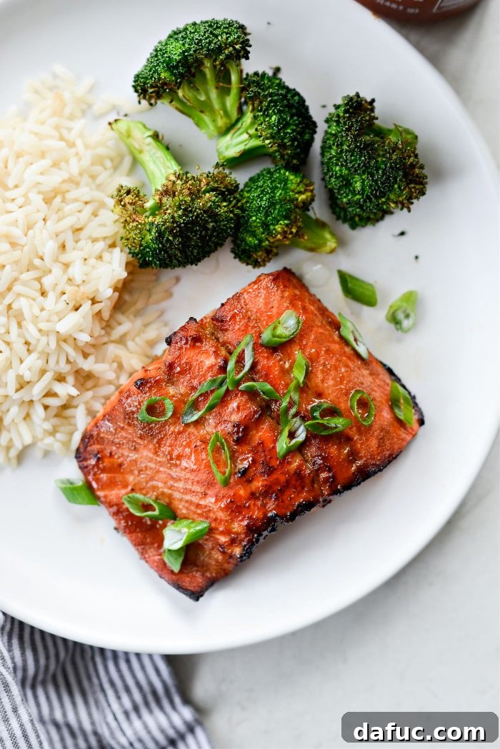 Close-up of a perfectly cooked Air Fryer Sriracha Salmon fillet