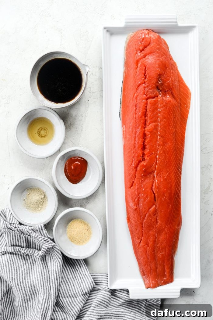 Ingredients for Air Fryer Sriracha Salmon laid out on a board