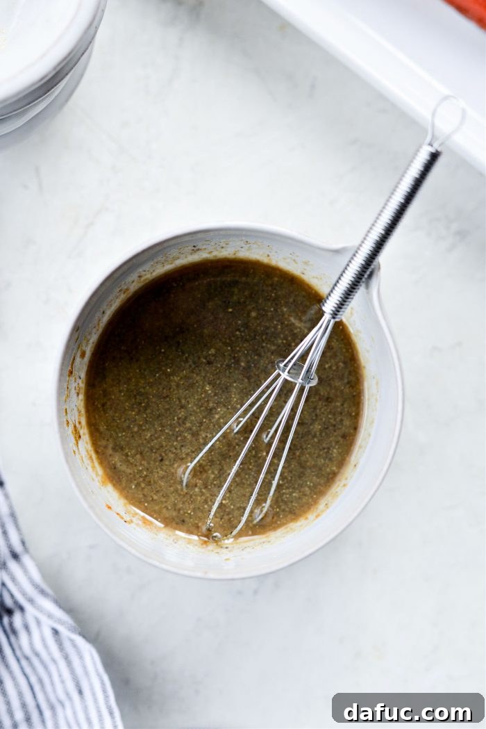 Ingredients for the salmon marinade being whisked in a bowl