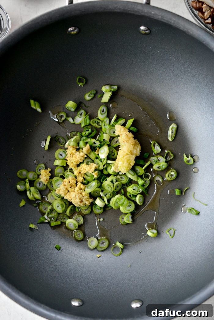 Golden Salmon Fried Rice 6 add light green parts of 4 green onions, ginger and garlic