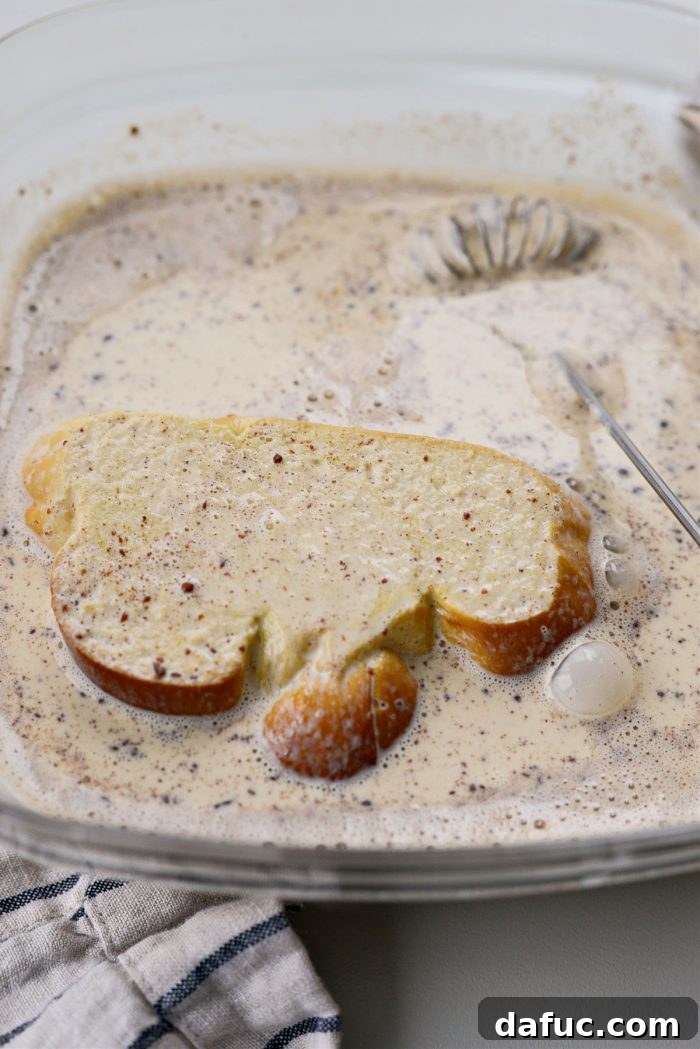 Caramelized Brown Sugar Baked French Toast 14 Dipping challah slices into French toast custard