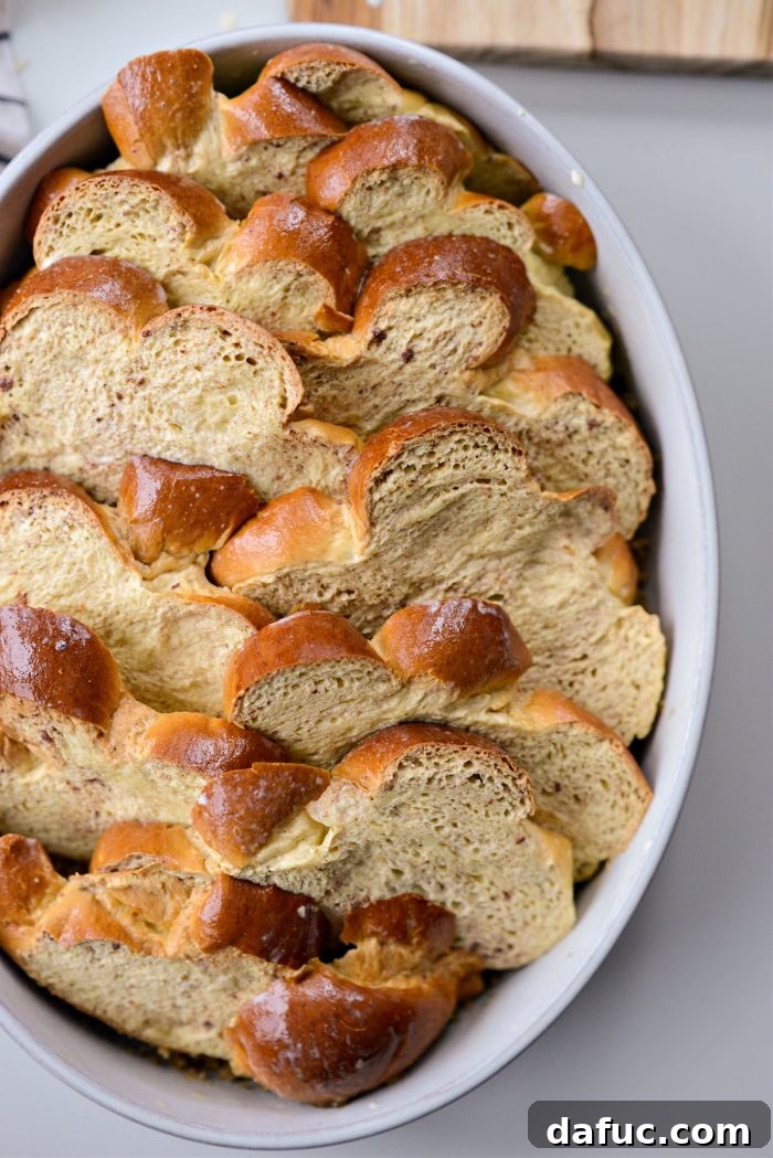 Caramelized Brown Sugar Baked French Toast 15 Arranging overlapping challah slices over brown sugar in baking dish