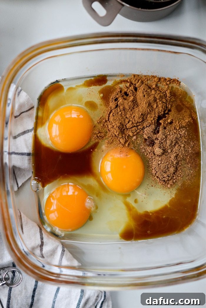 Caramelized Brown Sugar Baked French Toast 9 Eggs, vanilla, cinnamon, and nutmeg in a shallow bowl