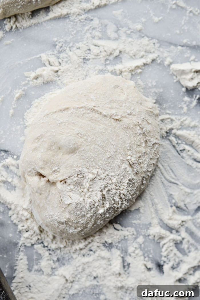 Dividing and dusting no-knead pizza dough with flour