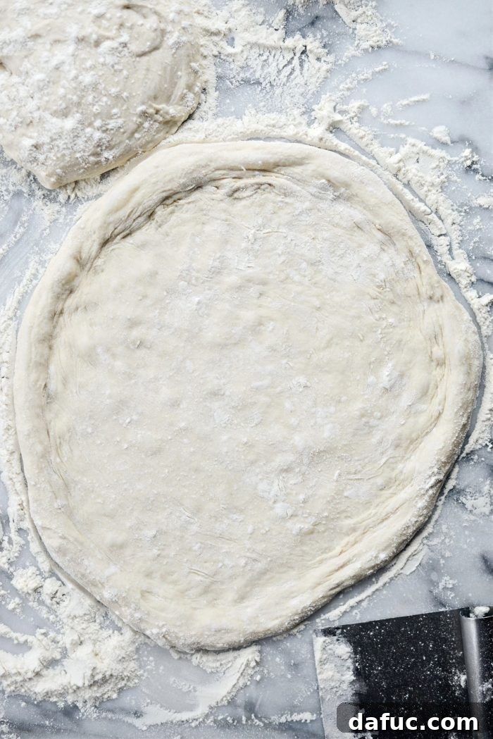 Shaped no-knead pizza dough with a visible crust edge