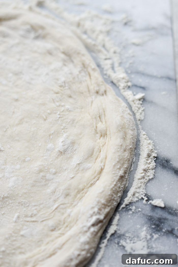 Air bubbles in pizza dough should not be popped for authentic texture