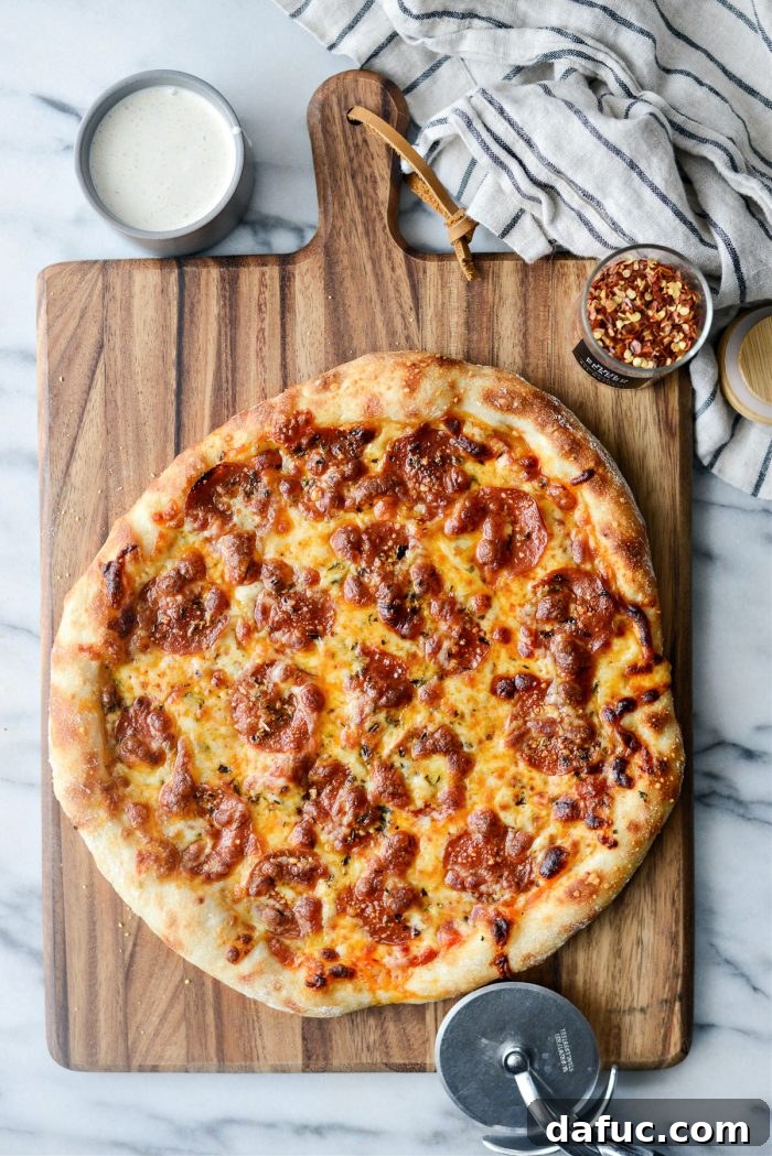 Freshly baked homemade No-Knead Pizza Dough with golden crust and melted cheese
