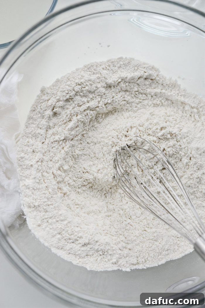Whisking dry ingredients together for pizza dough