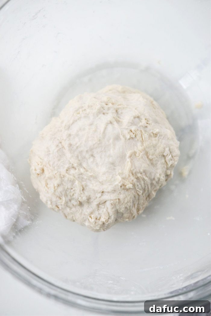 Covering the pizza dough for a 24-hour rest
