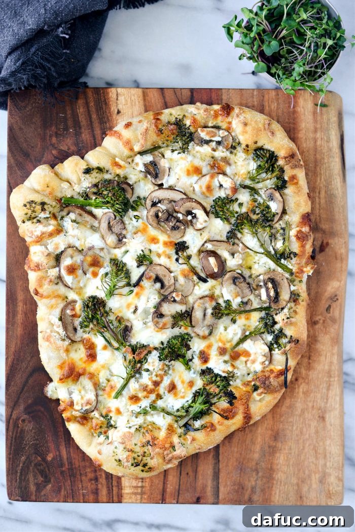 A freshly baked Green Forest Pizza, golden and bubbling, just out of the oven