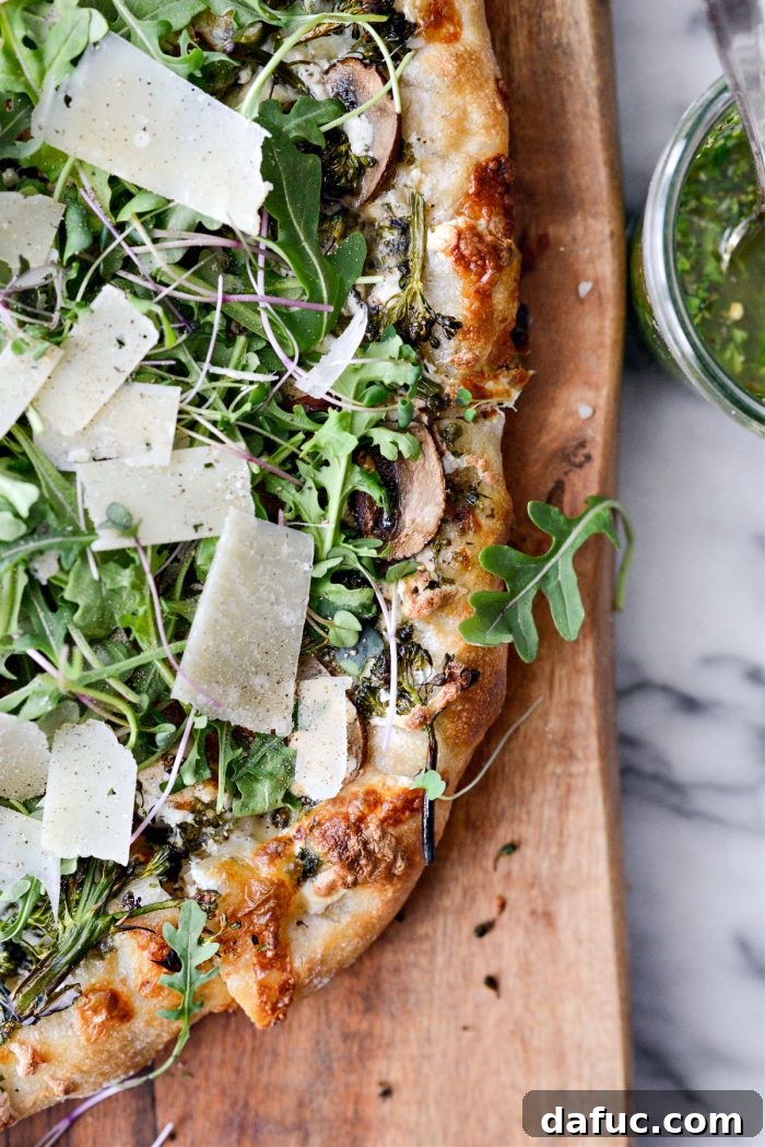 A close-up of the finished Green Forest Pizza with fresh toppings