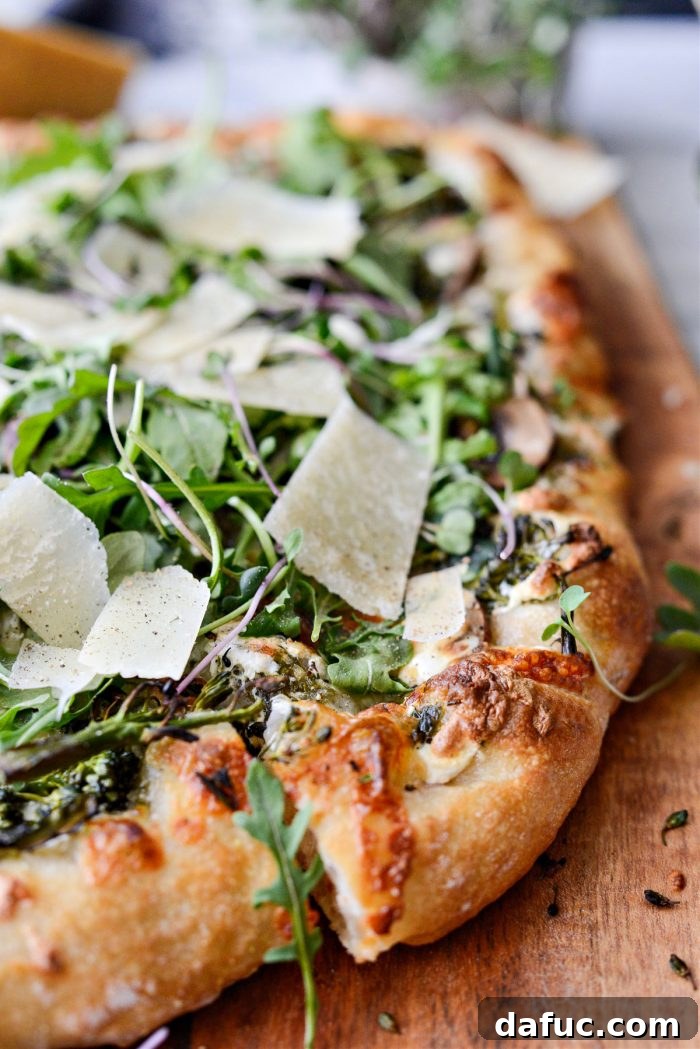 Detail shot of the crispy crust on the Green Forest Pizza