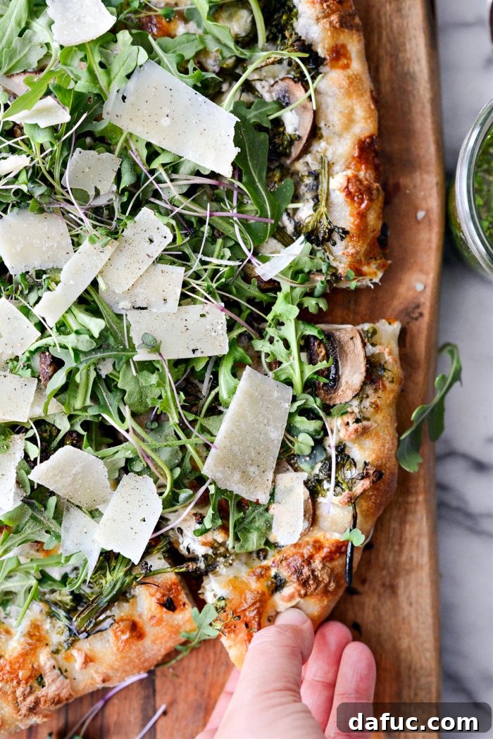 Green Forest Pizza on a wooden board, showcasing its vibrant colors