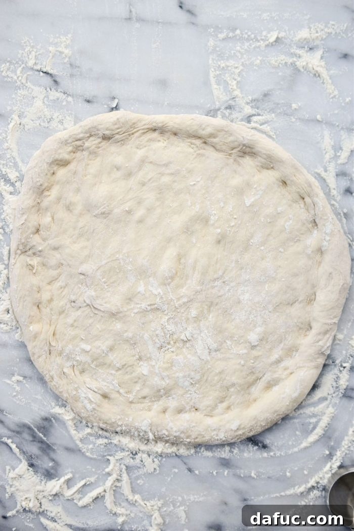 Stretched pizza dough, ready for toppings