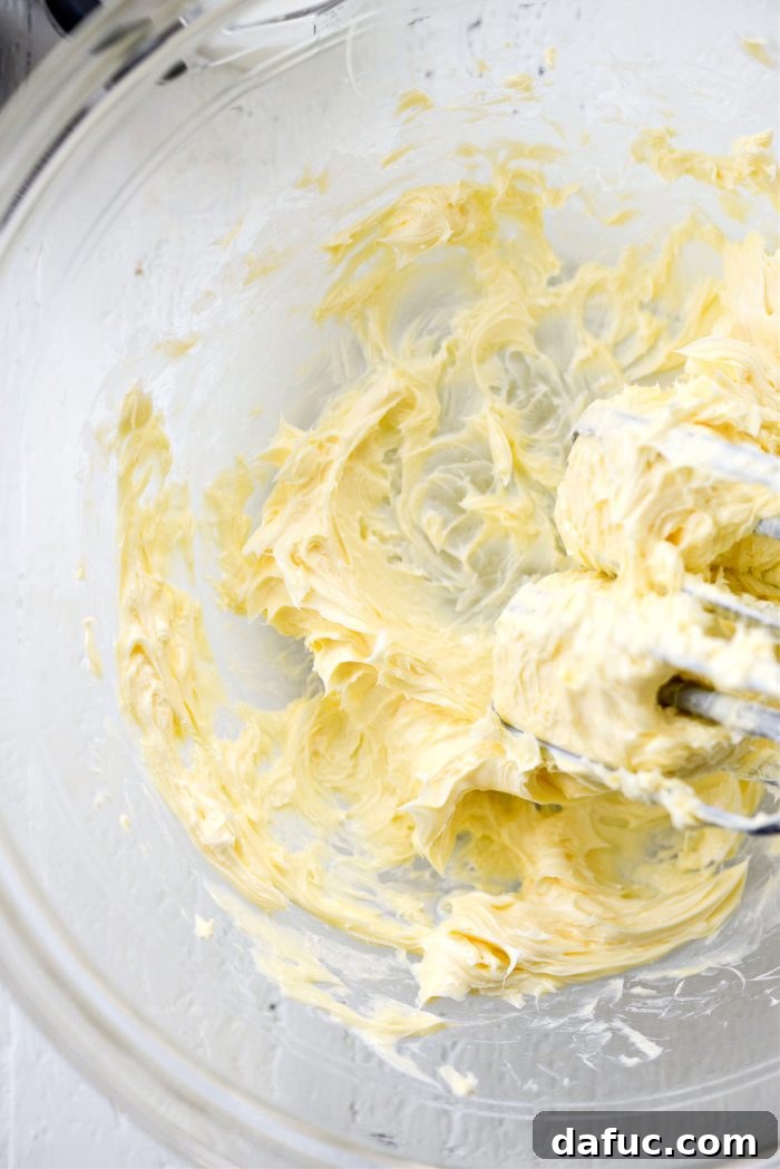 Tangy Lemon Cupcakes with Velvety Frosting 11 Softened unsalted butter creaming in a large mixing bowl, becoming light and fluffy