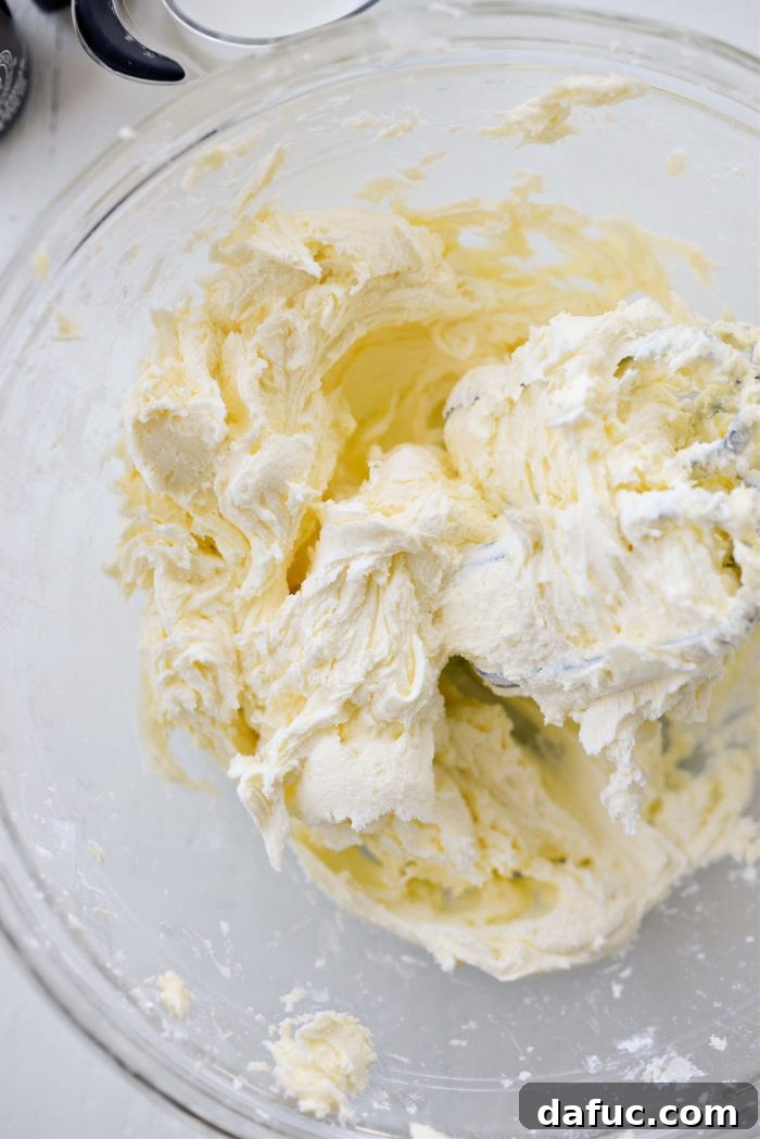 Tangy Lemon Cupcakes with Velvety Frosting 13 Creamed butter and sifted powdered sugar mixed together to form a thick, cohesive frosting base