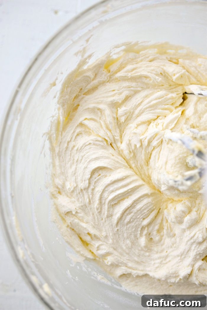 Tangy Lemon Cupcakes with Velvety Frosting 18 A bowl of finished lemon buttercream, smooth, creamy, and ready for frosting