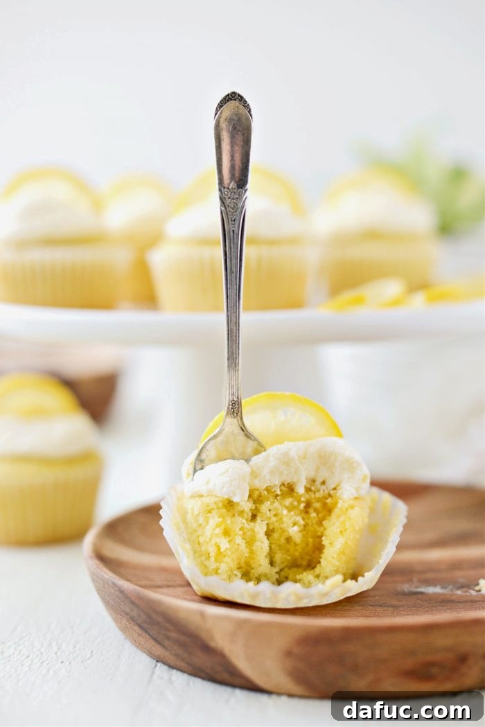 Tangy Lemon Cupcakes with Velvety Frosting 23 Close-up of a perfectly baked and frosted lemon cupcake, ready to be enjoyed