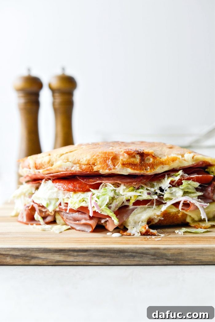 Old World Italian Sub 2 The ultimate Italian Grinder sandwich showcasing its toasted bread, melted cheese, and fresh ingredients.