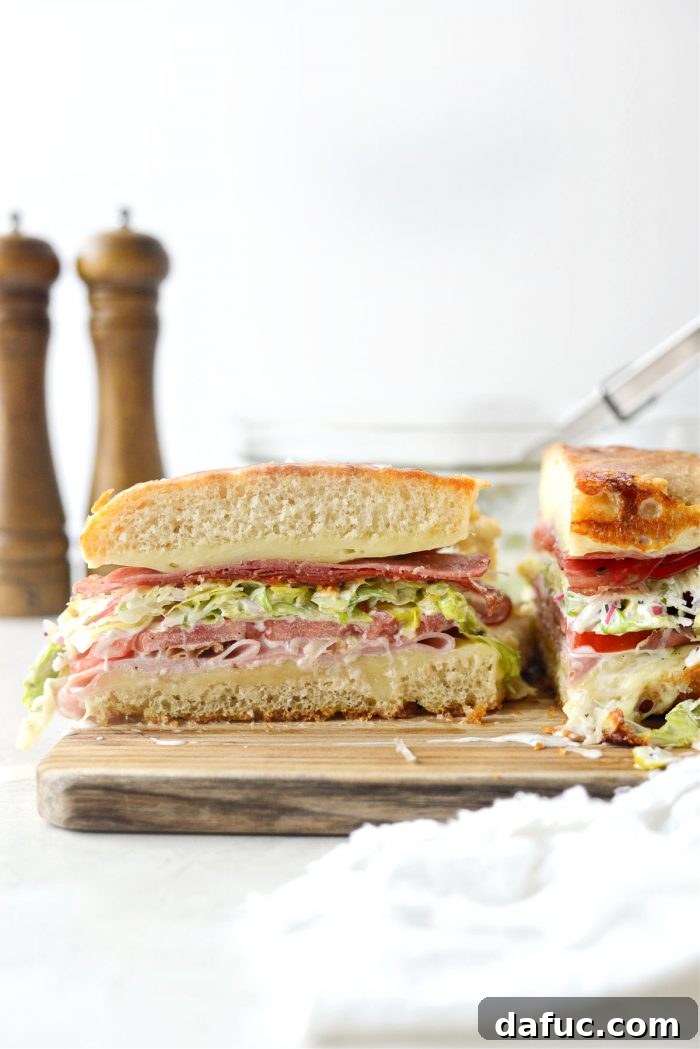 Old World Italian Sub 3 Close-up of a prepared Italian Grinder, showing the layers of meat, cheese, and salad before serving.