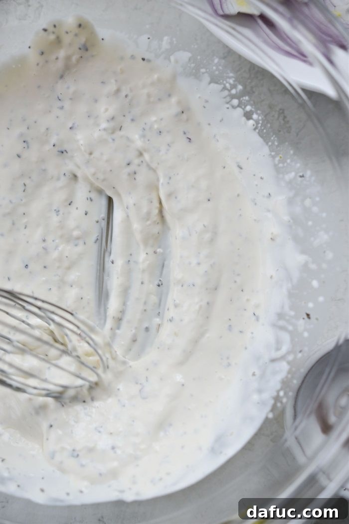 Old World Italian Sub 9 The creamy and well-combined grinder salad dressing in a bowl.