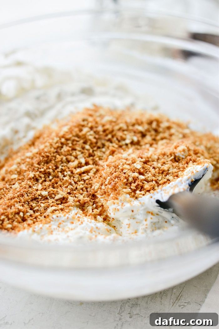 Adding most of the toasted panko breadcrumbs to the dip