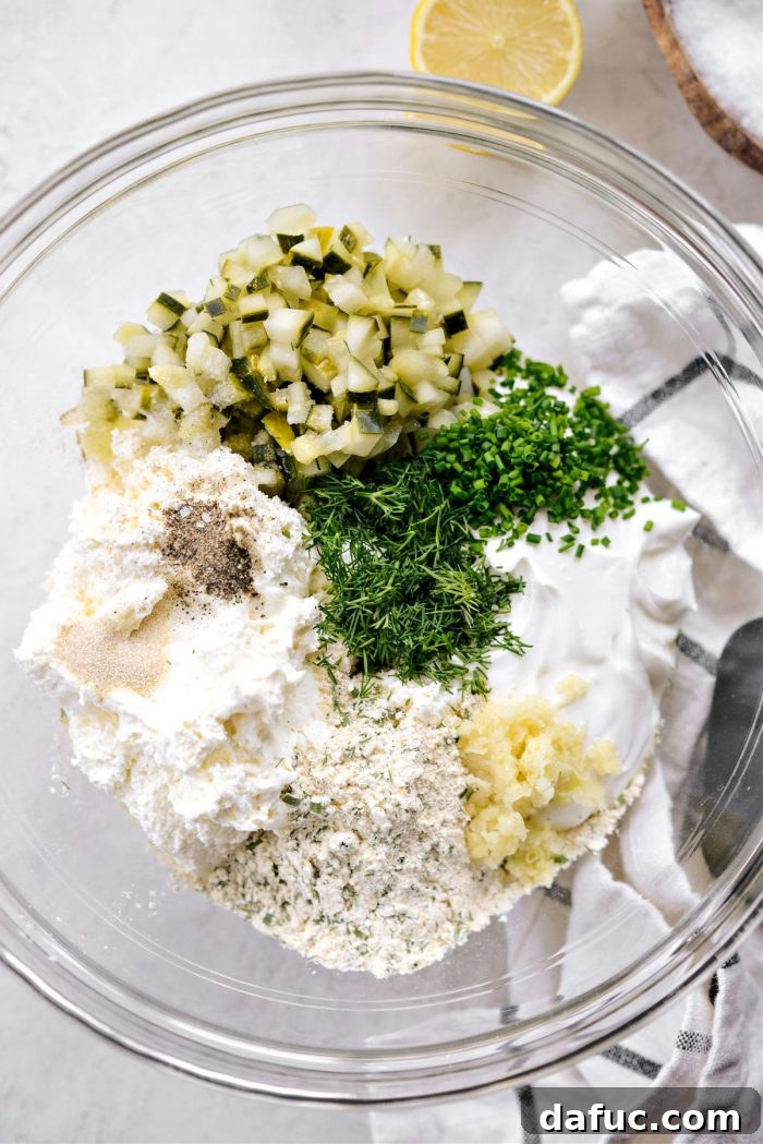 Southern Fried Pickle Ranch Dip 7 Mixing cream cheese, sour cream, pickle, garlic, ranch seasoning, herbs, salt, and pepper