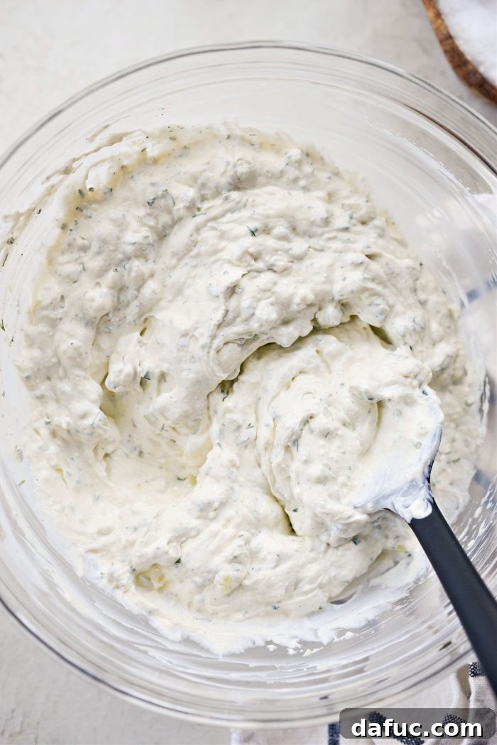 The dip mixture covered and chilling in the refrigerator