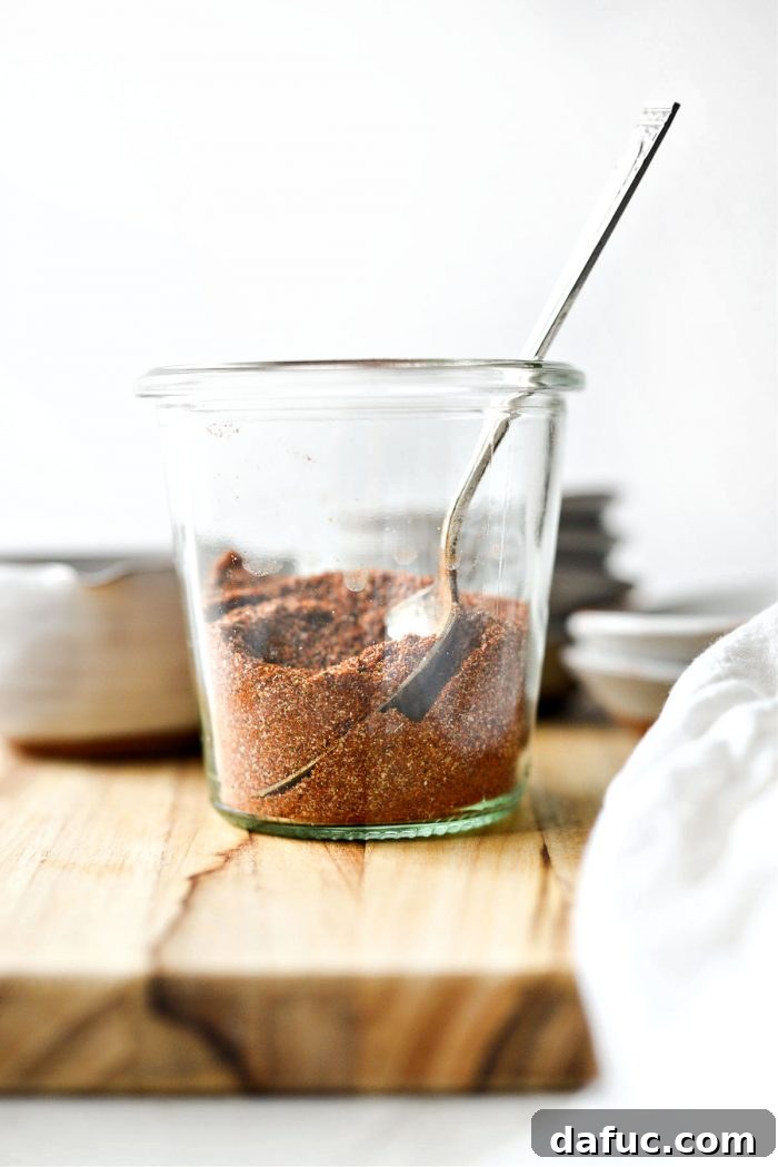 A well-sealed jar of homemade Street Taco Seasoning positioned on a wooden surface, ready for long-term storage.