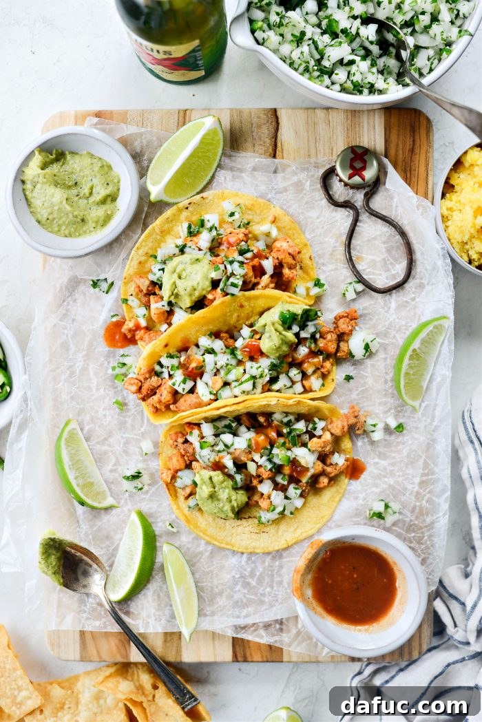 Delicious Chicken Street Tacos served on a platter with fresh lime wedges and cilantro