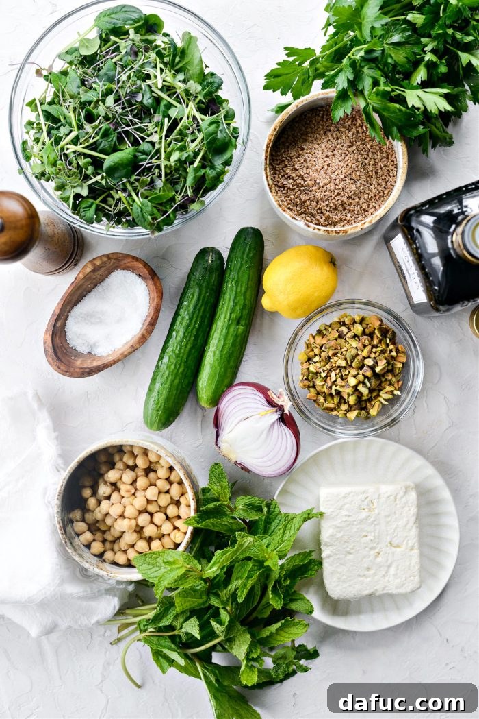 Fresh ingredients for the Jennifer Aniston Salad spread out on a cutting board