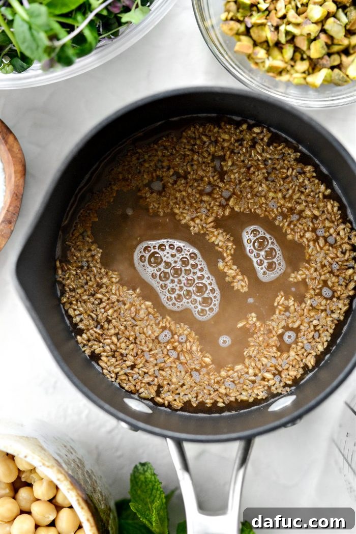 Bulgur wheat simmering in a saucepan