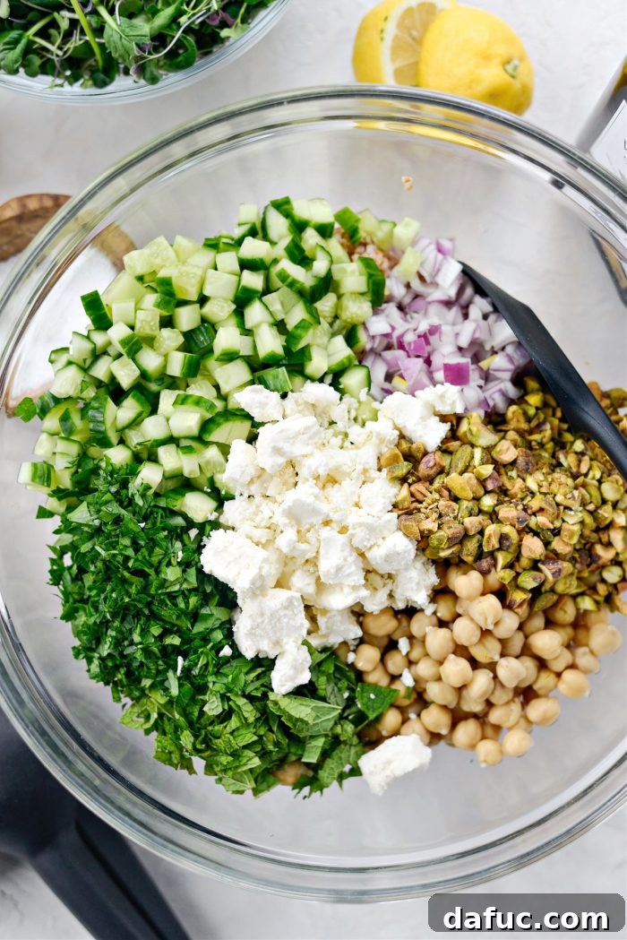 Various Jennifer Aniston Salad ingredients in a large mixing bowl