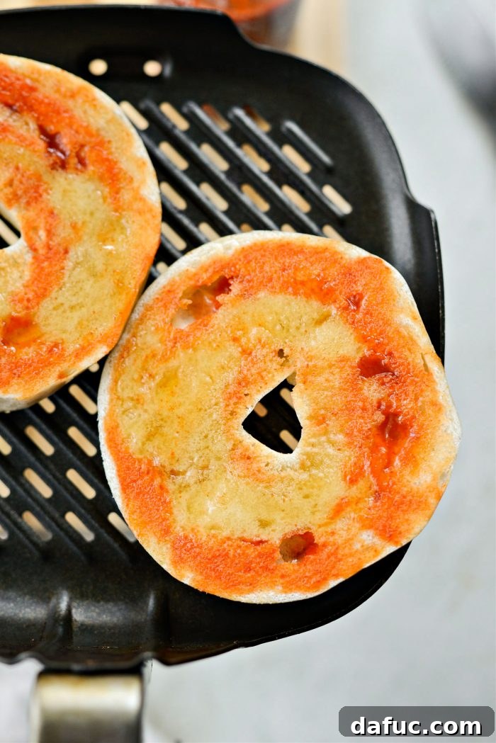 Sweet & Spicy Bagel with Zesty Chive Cream Cheese 12 Honey Sriracha bagel halves placed cut-side up on an air fryer insert