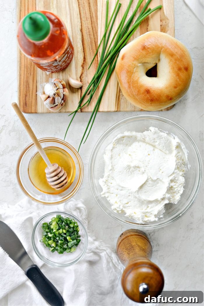 Sweet & Spicy Bagel with Zesty Chive Cream Cheese 4 Ingredients for Honey Sriracha Toasted Bagel with scallion chive cream cheese laid out