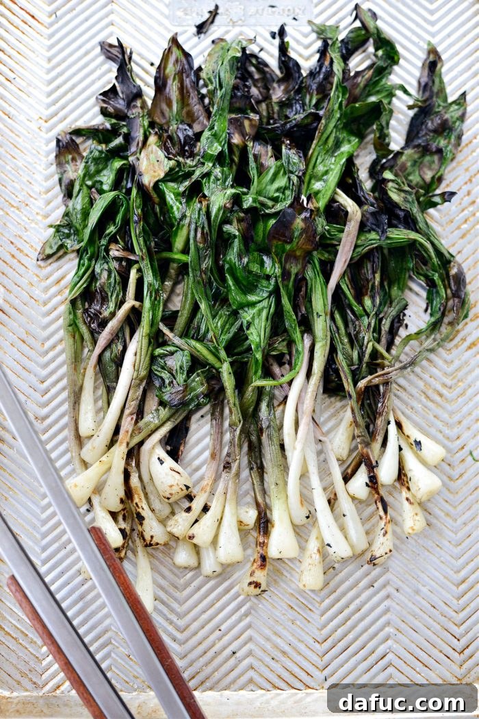 Charred Ramps Perfection 22 Finished grilled ramps and charred lemons on a sheet pan