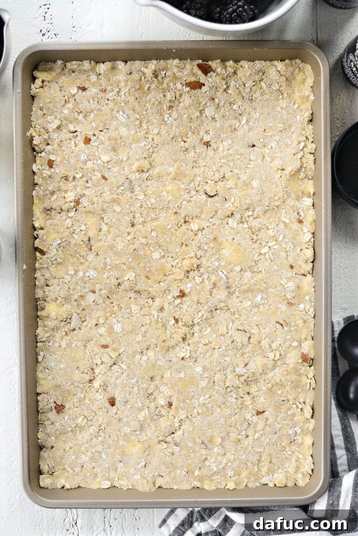 Blackberry Almond Crumble Bars 12 Pressing streusel mixture firmly into the pan with a glass