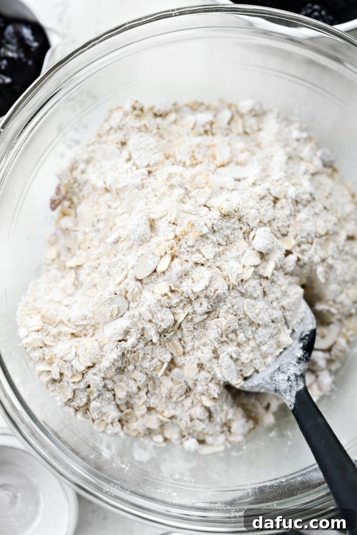 Blackberry Almond Crumble Bars 6 Stirring dry ingredients to combine evenly