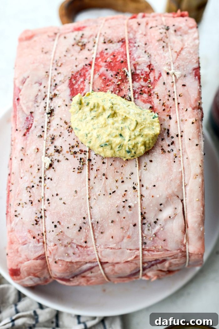 Rosemary Dijon Crusted Prime Rib with Pinot Noir Au Jus 14 Rib roast coated with Dijon rosemary rub.