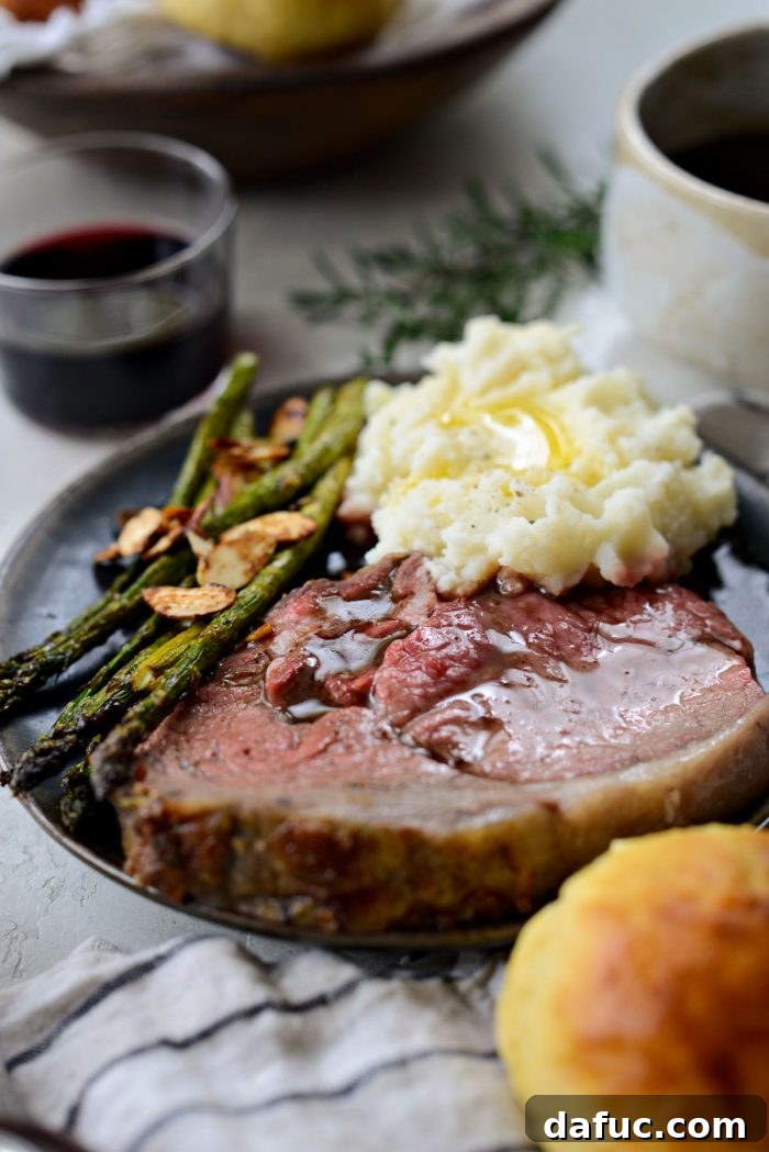 Rosemary Dijon Crusted Prime Rib with Pinot Noir Au Jus 28 Dijon Rosemary Prime Rib Roast with mashed potatoes and asparagus.