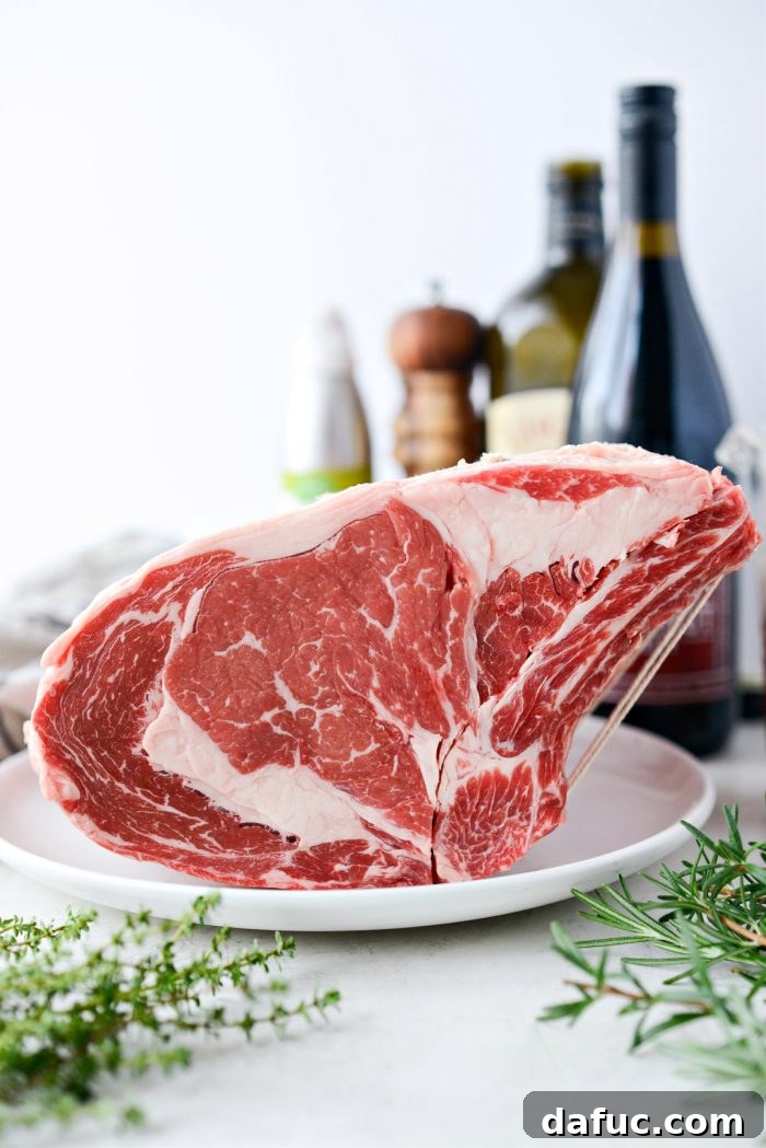 Rosemary Dijon Crusted Prime Rib with Pinot Noir Au Jus 5 Side view of an 8-pound standing rib roast.