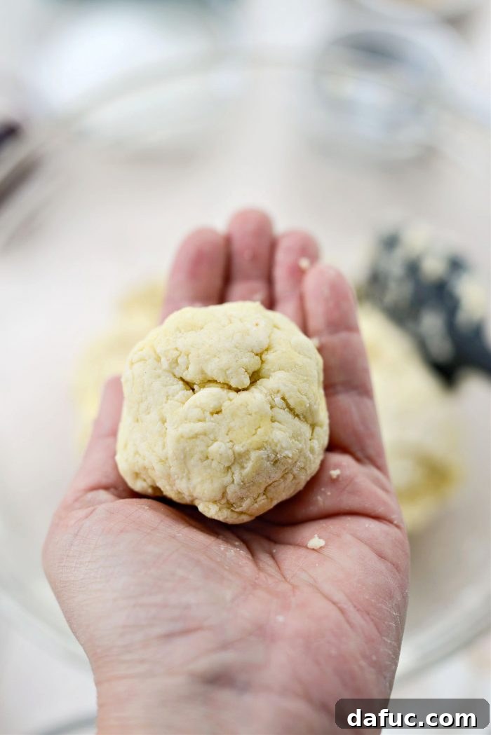 Shaping shortcake dough into 8 craggy balls.