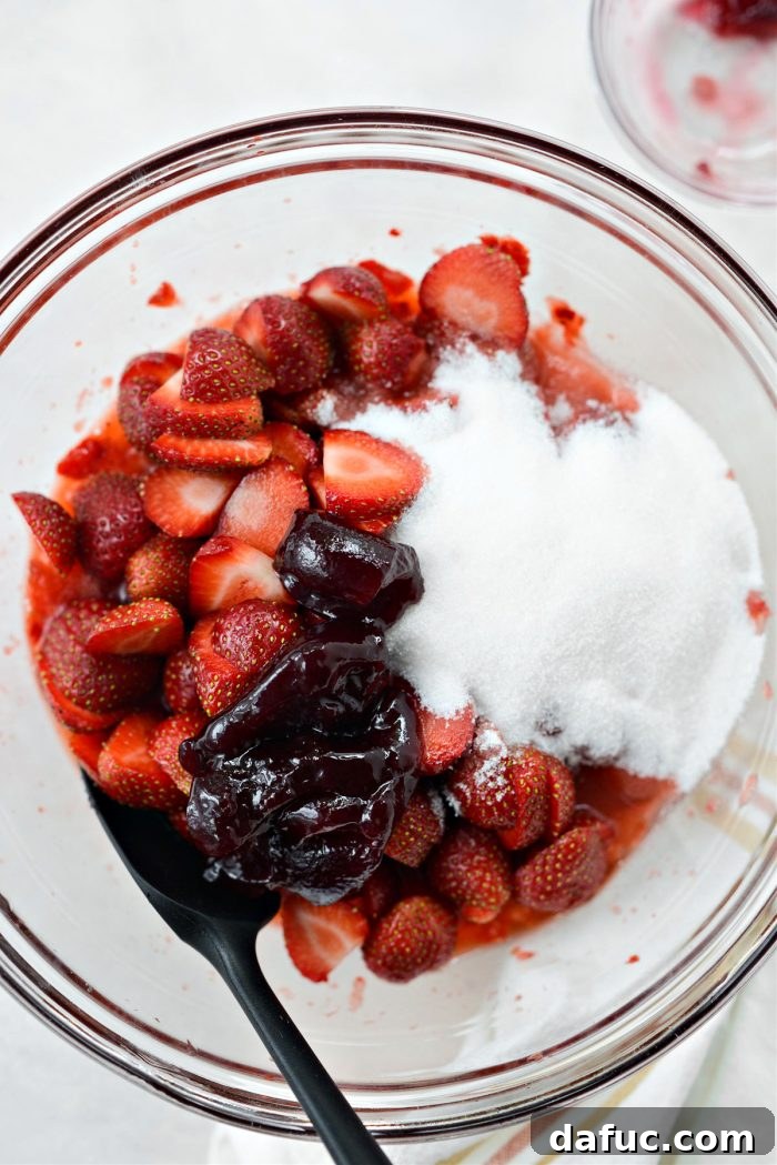 Freshly Baked Strawberry Dream 18 Mixing jam and sugar with strawberries
