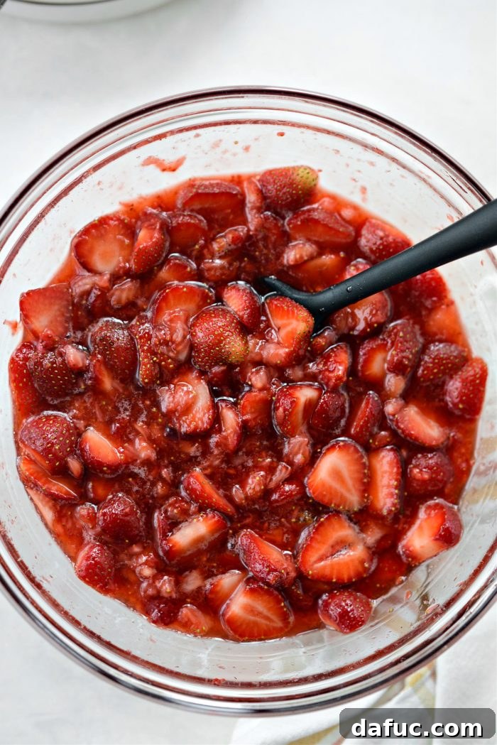 Macerated strawberries with released juices, ready for shortcake.
